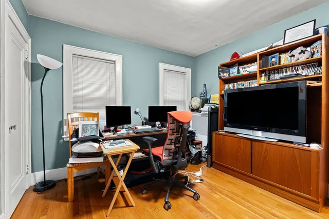 a view of a livingroom with furniture and a flat screen tv
