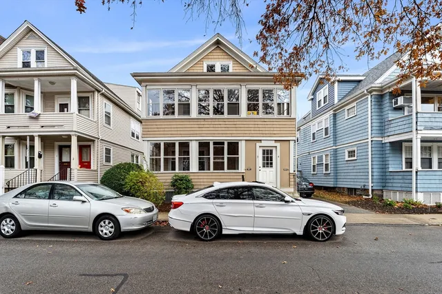 a car parked in front of a house