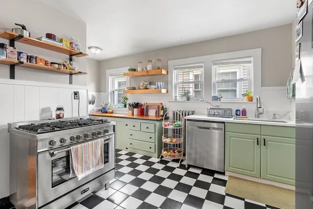 a kitchen with a stove top oven sink and cabinets