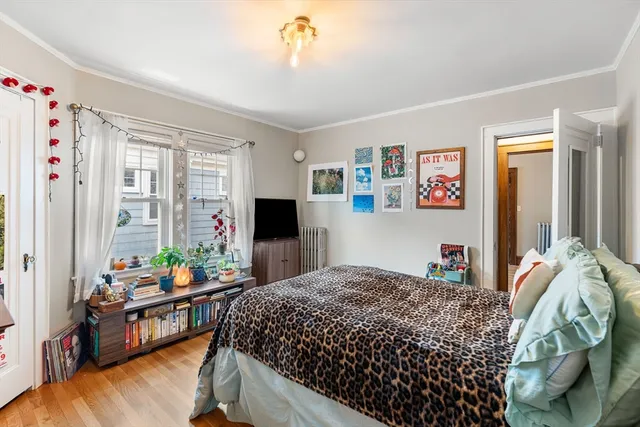 a bedroom with bed and a window