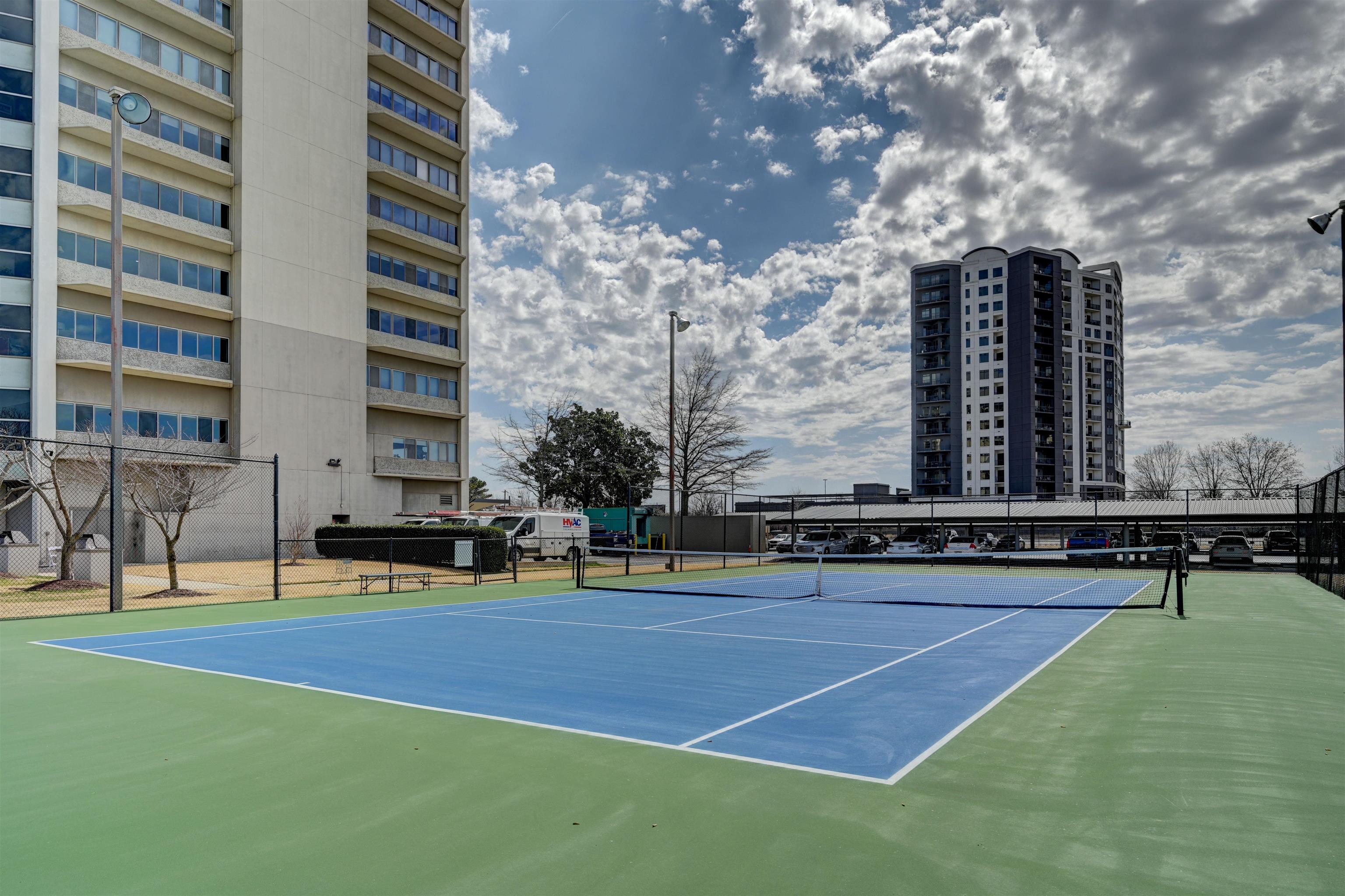 655 Riverside Drive, Unit 606A Memphis, TN 38103 - Photo 26 of 35 a swimming pool with outdoor seating and yard
