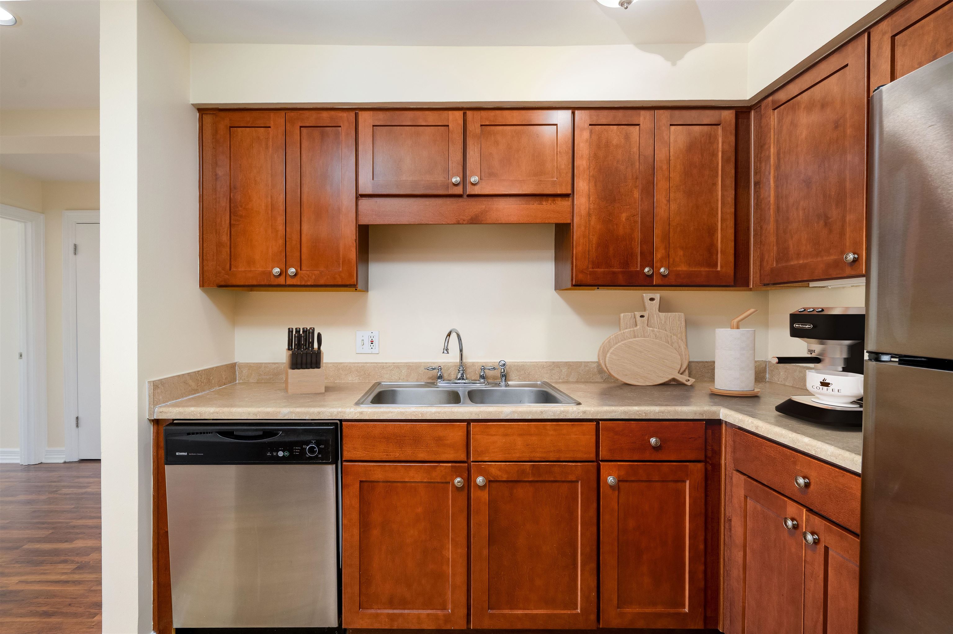 655 Riverside Drive, Unit 606A Memphis, TN 38103 - Photo 6 of 35 a kitchen with stainless steel appliances granite countertop a sink a stove and cabinets