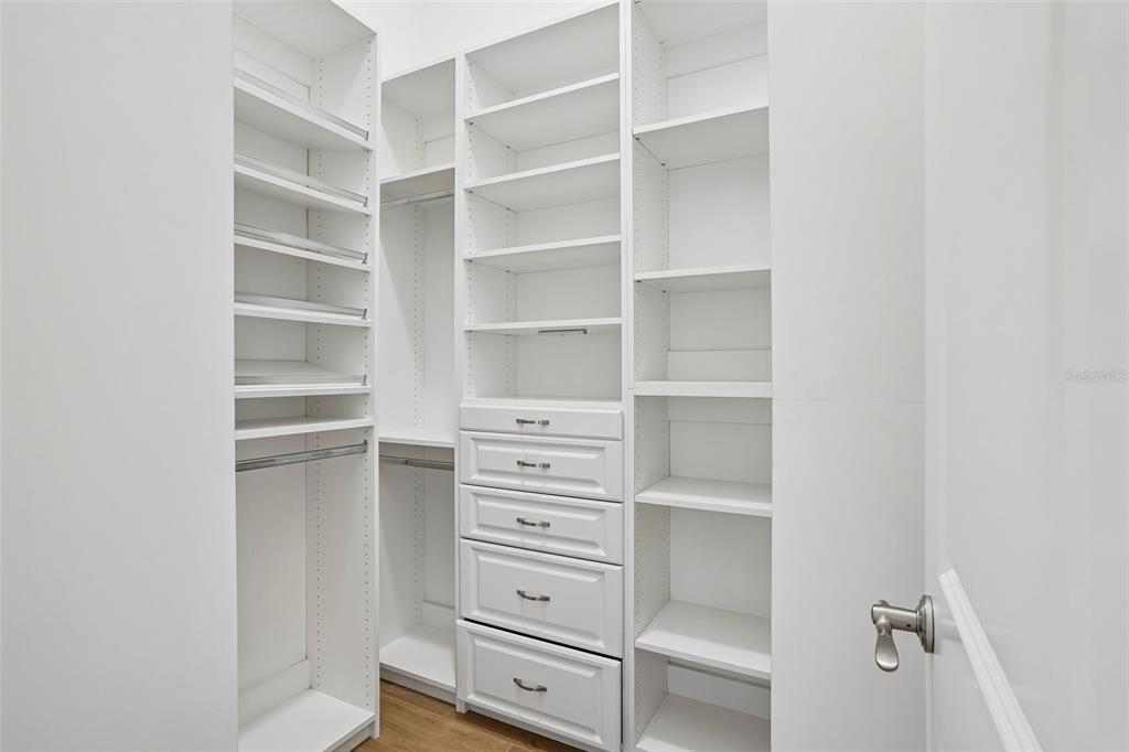 10339 Addison Shore Way Oxford, FL 34484 - Photo 44 of 54 a view of walk in closet with empty racks