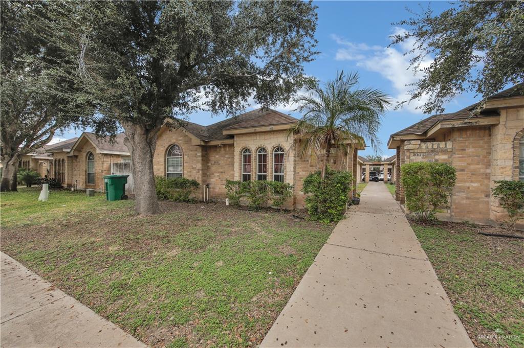 3701 South Embassy Avenue Pharr, TX 78577 - Photo 3 of 5 a front view of a house with a garden
