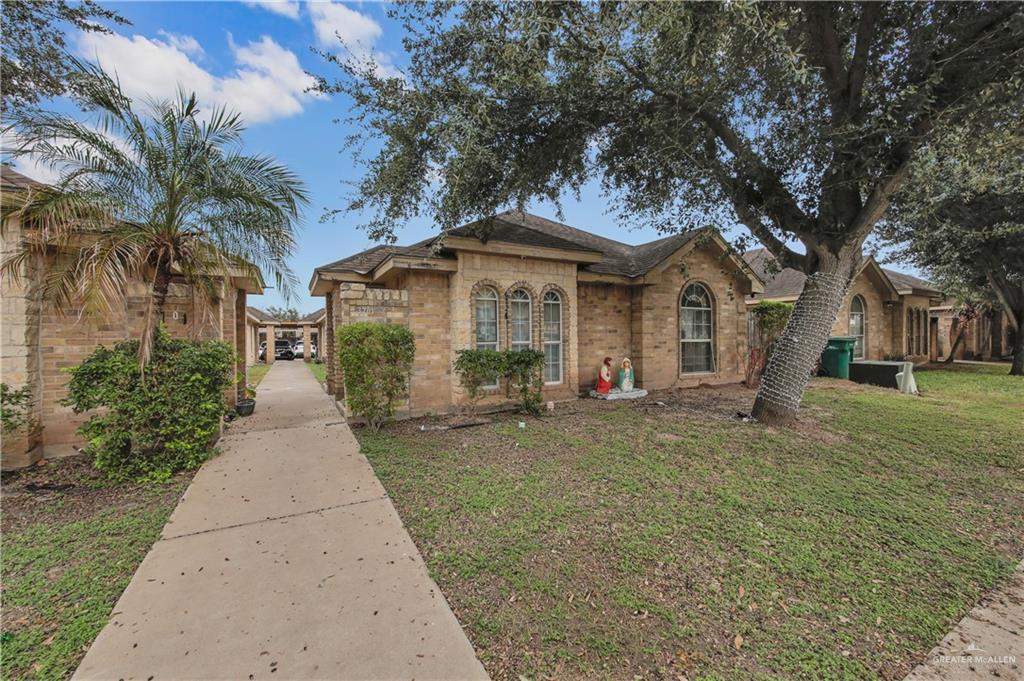 3701 South Embassy Avenue Pharr, TX 78577 - Photo 4 of 5 a front view of a house with a garden