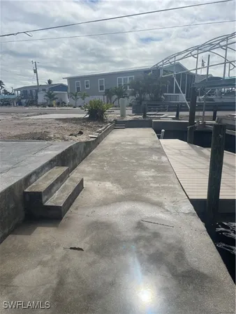 a view of a backyard of the house