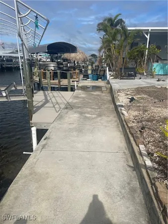 a view of a backyard with sitting area