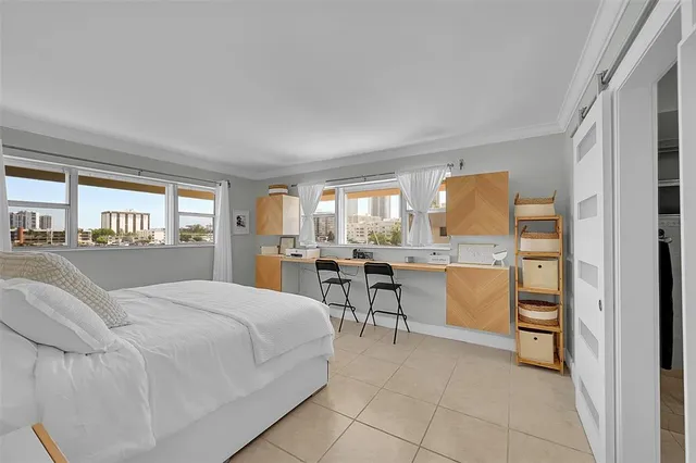 a bedroom with a bed and a cabinets