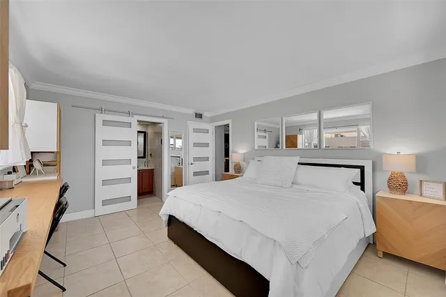 a large white bed in a white room