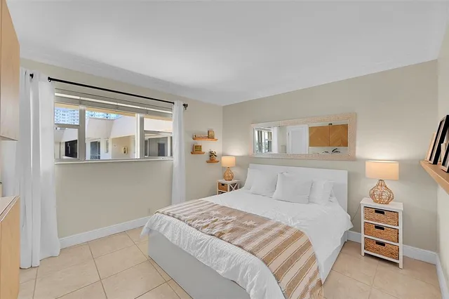 a bedroom with a bed and a cabinets