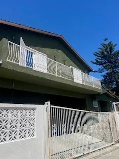 a front view of a house with parking space