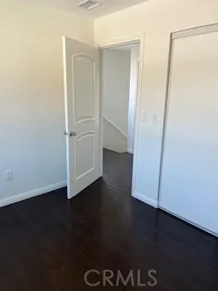 an empty room with wooden floor