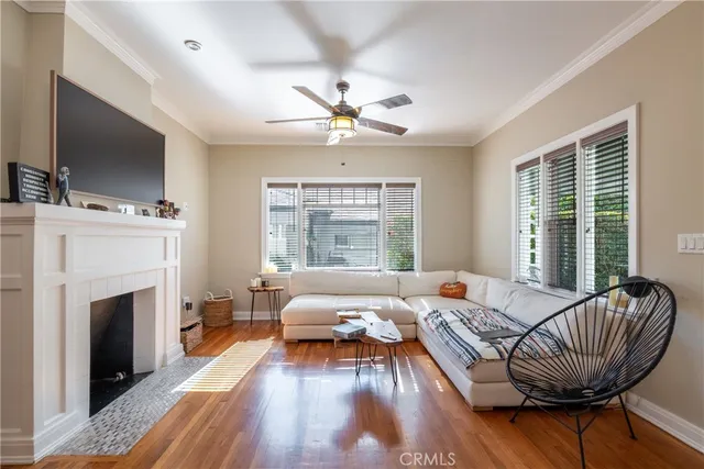 a living room with furniture fireplace and flat screen tv