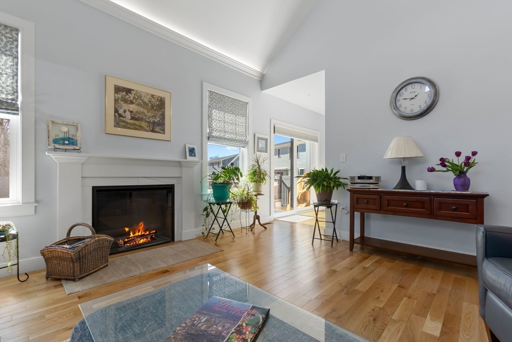 18 Primrose Lane, Unit 18 Ipswich, MA 01938 - Photo 11 of 39 a living room with furniture and a fireplace