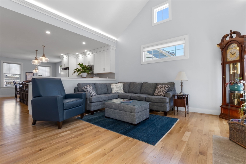 18 Primrose Lane, Unit 18 Ipswich, MA 01938 - Photo 12 of 39 a living room with furniture and a wooden floor