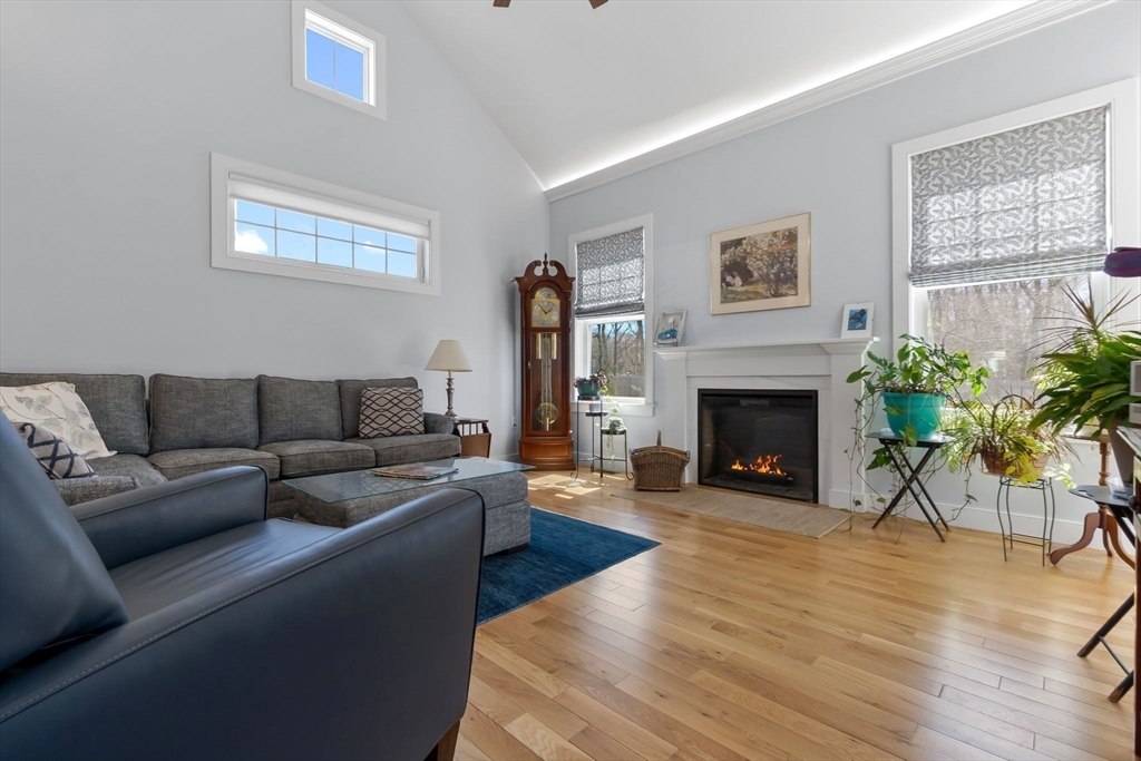 18 Primrose Lane, Unit 18 Ipswich, MA 01938 - Photo 13 of 39 a living room with furniture and a fireplace