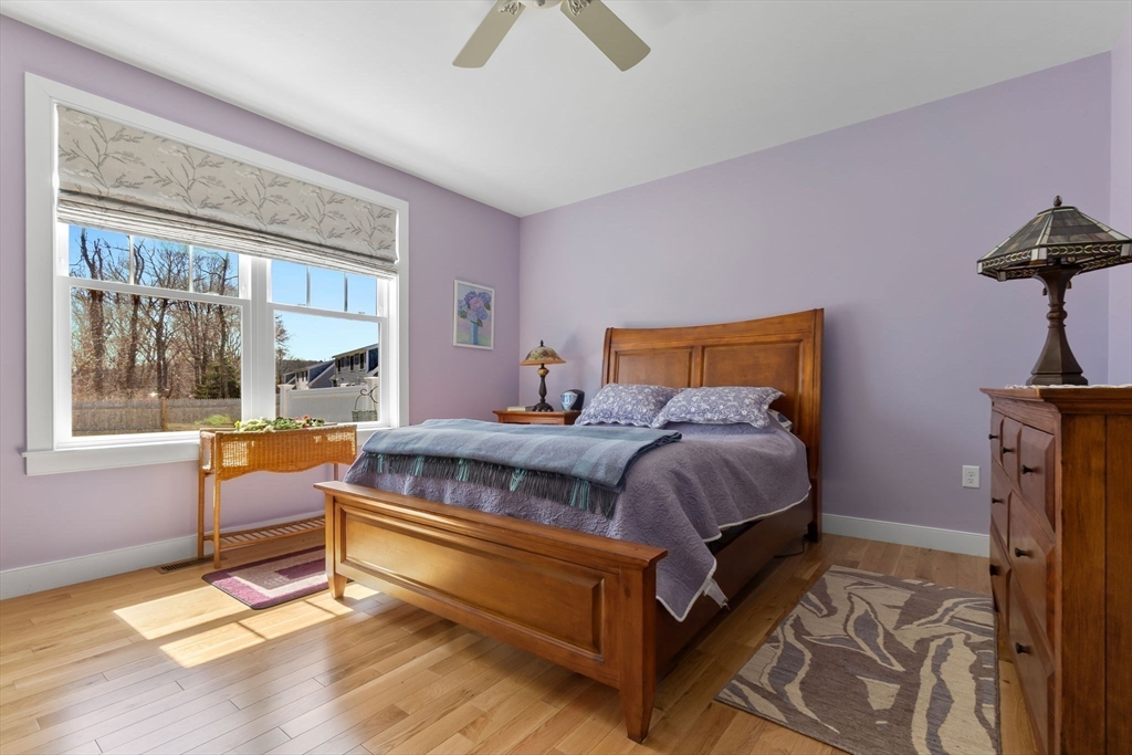 18 Primrose Lane, Unit 18 Ipswich, MA 01938 - Photo 15 of 39 a bedroom with a bed and window
