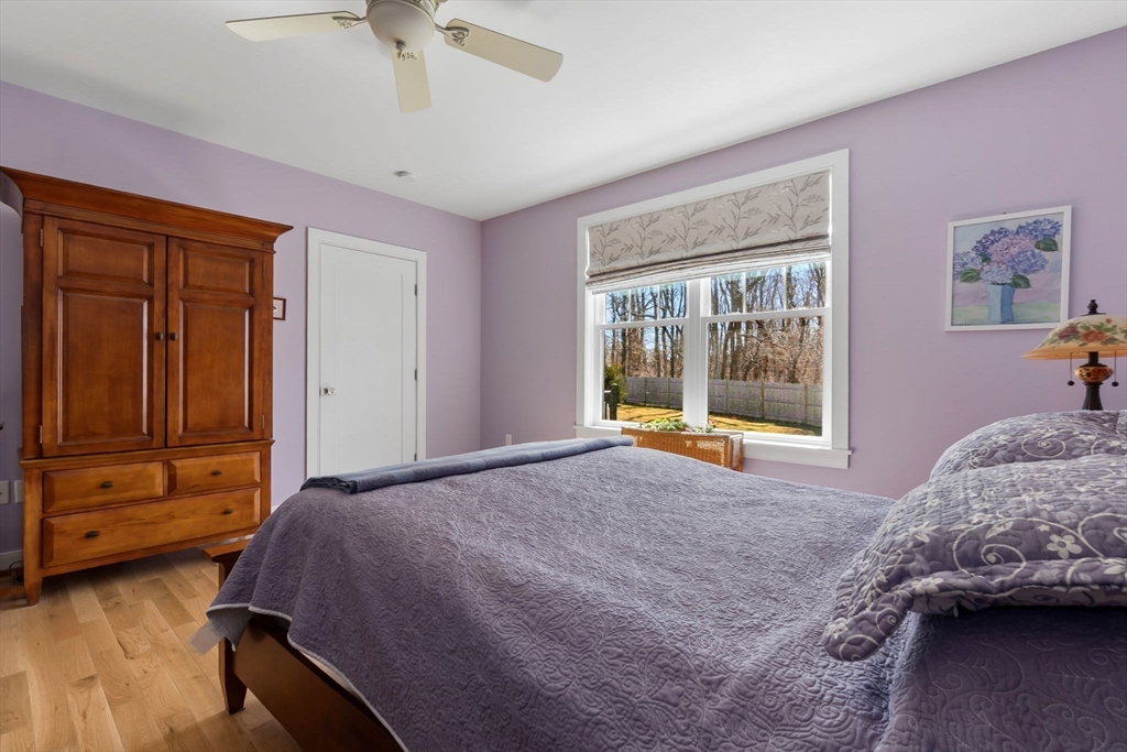 18 Primrose Lane, Unit 18 Ipswich, MA 01938 - Photo 16 of 39 a bedroom with a bed and a window