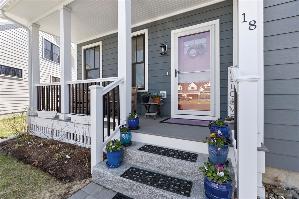 18 Primrose Lane, Unit 18 Ipswich, MA 01938 - Photo 2 of 39 a view of a house with potted plants