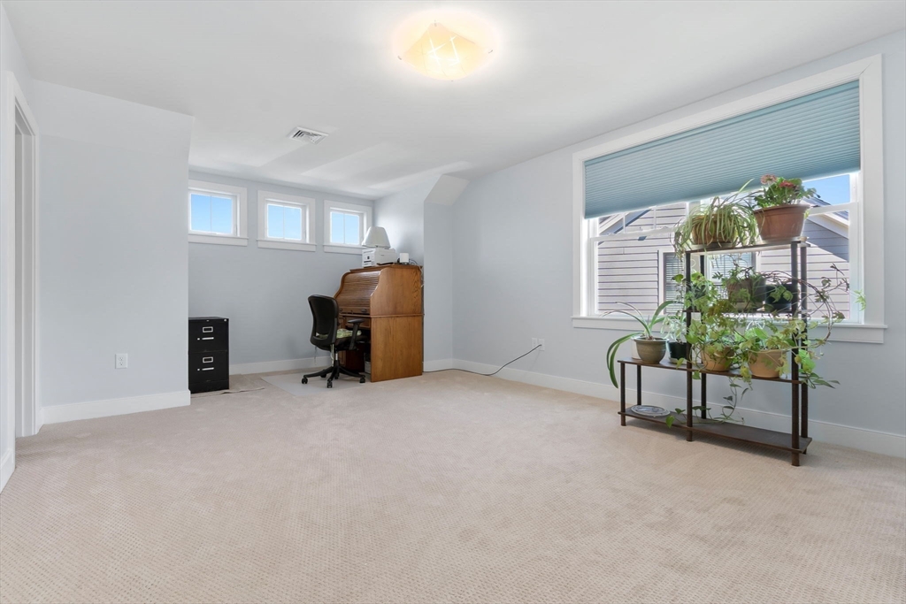18 Primrose Lane, Unit 18 Ipswich, MA 01938 - Photo 27 of 39 a room with furniture and a window