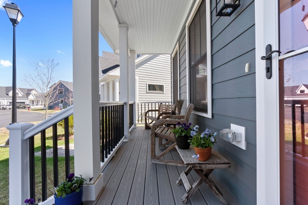 18 Primrose Lane, Unit 18 Ipswich, MA 01938 - Photo 3 of 39 a view of a balcony with chairs