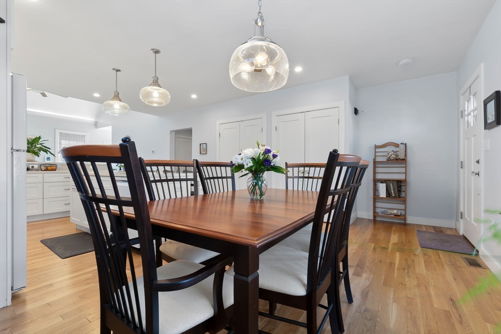 18 Primrose Lane, Unit 18 Ipswich, MA 01938 - Photo 9 of 39 a view of a dining room with furniture and wooden floor