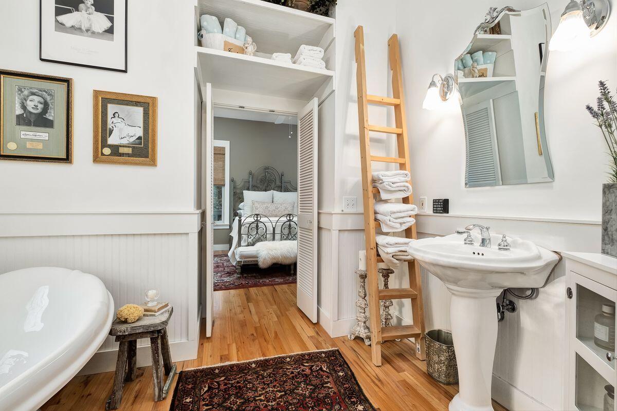 126 East Bayou Forest Drive Freeport, FL 32439 - Photo 18 of 35 a bathroom with a sink a mirror and a shower