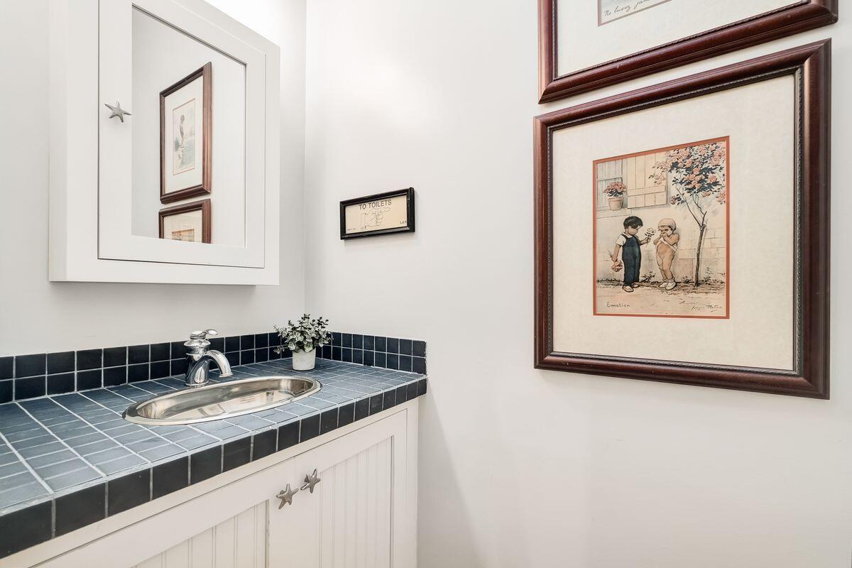 126 East Bayou Forest Drive Freeport, FL 32439 - Photo 26 of 35 a bathroom with a sink and a mirror