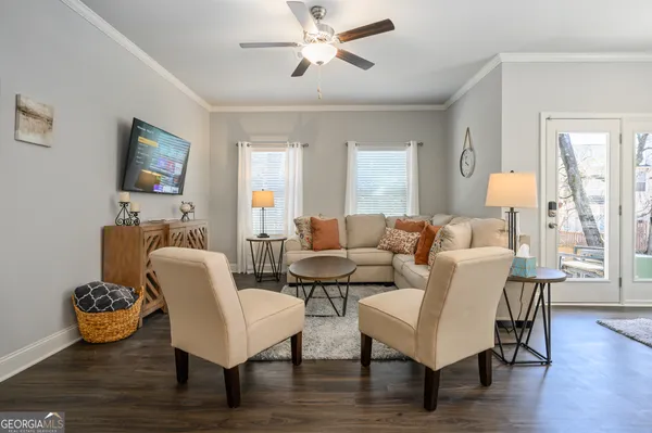 a living room with furniture and a flat screen tv