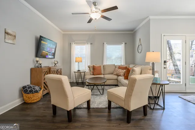 a living room with furniture and a flat screen tv