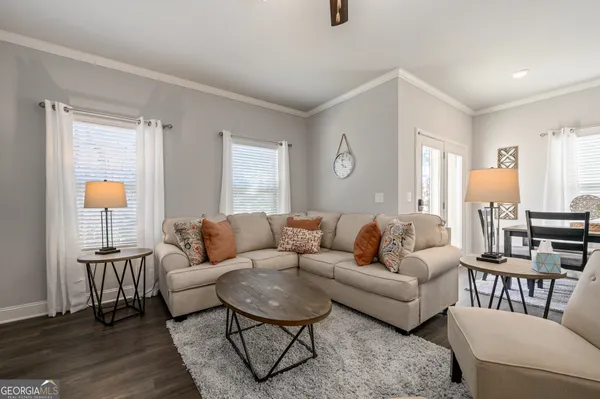 a living room with furniture and a table