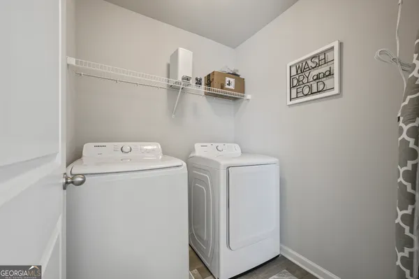 a utility room with dryer and washer