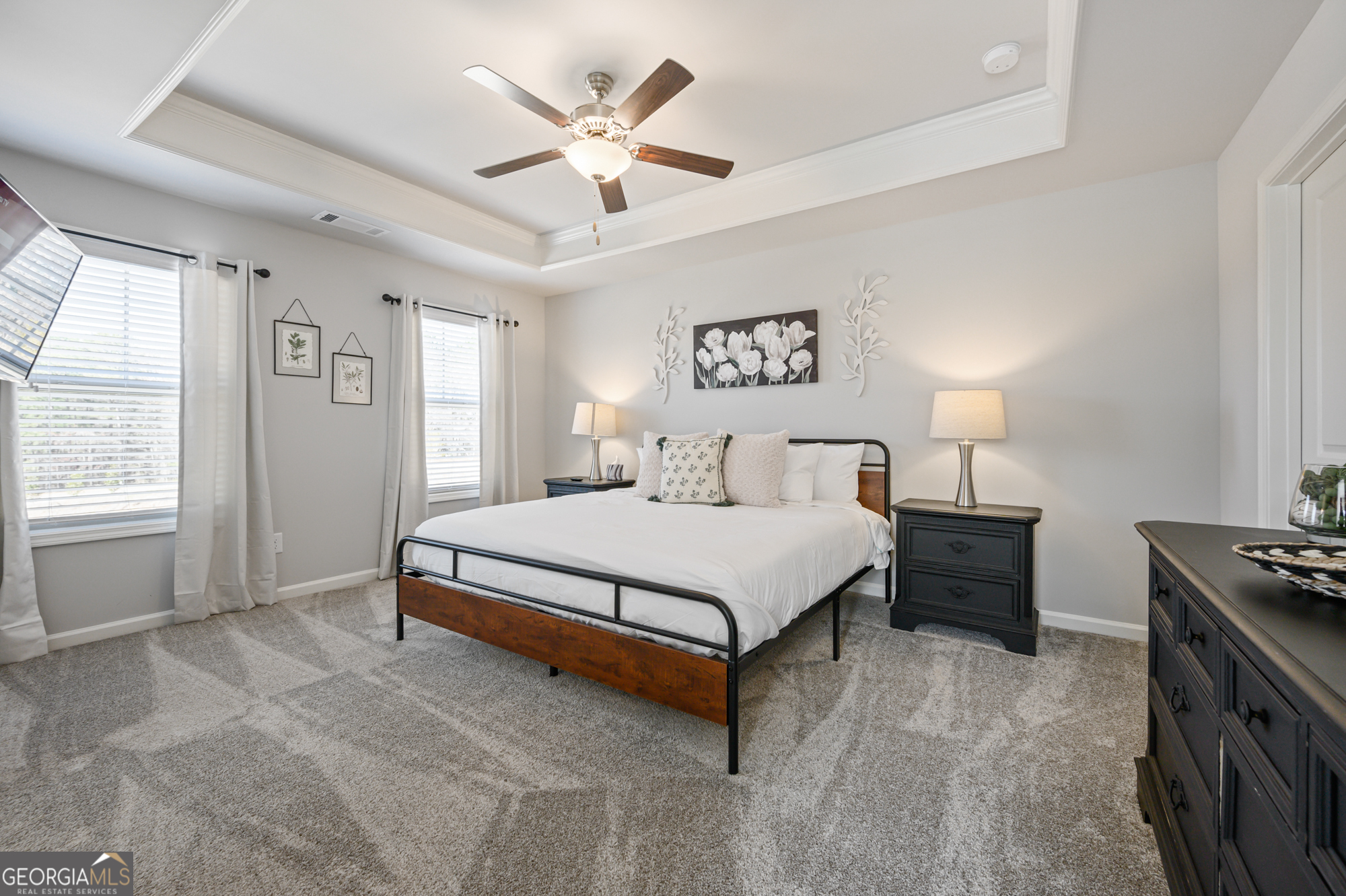 2059 Pinnacle Walk Norcross, GA 30071 - Photo 21 of 27 a spacious bedroom with a bed a ceiling fan and a window