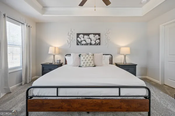 a bedroom with a bed and window