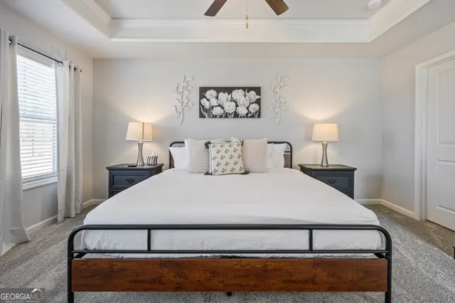 a bedroom with a bed and window