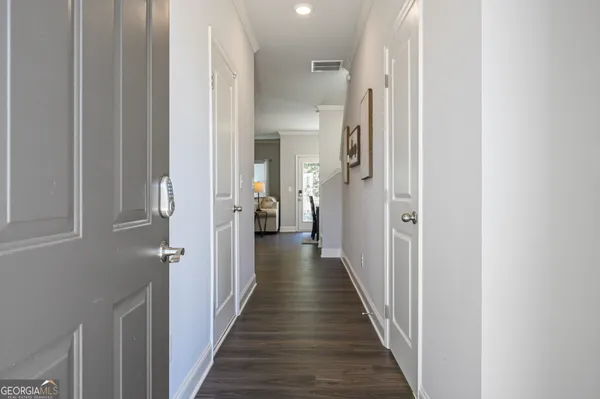 a view of a hallway with a wooden floor