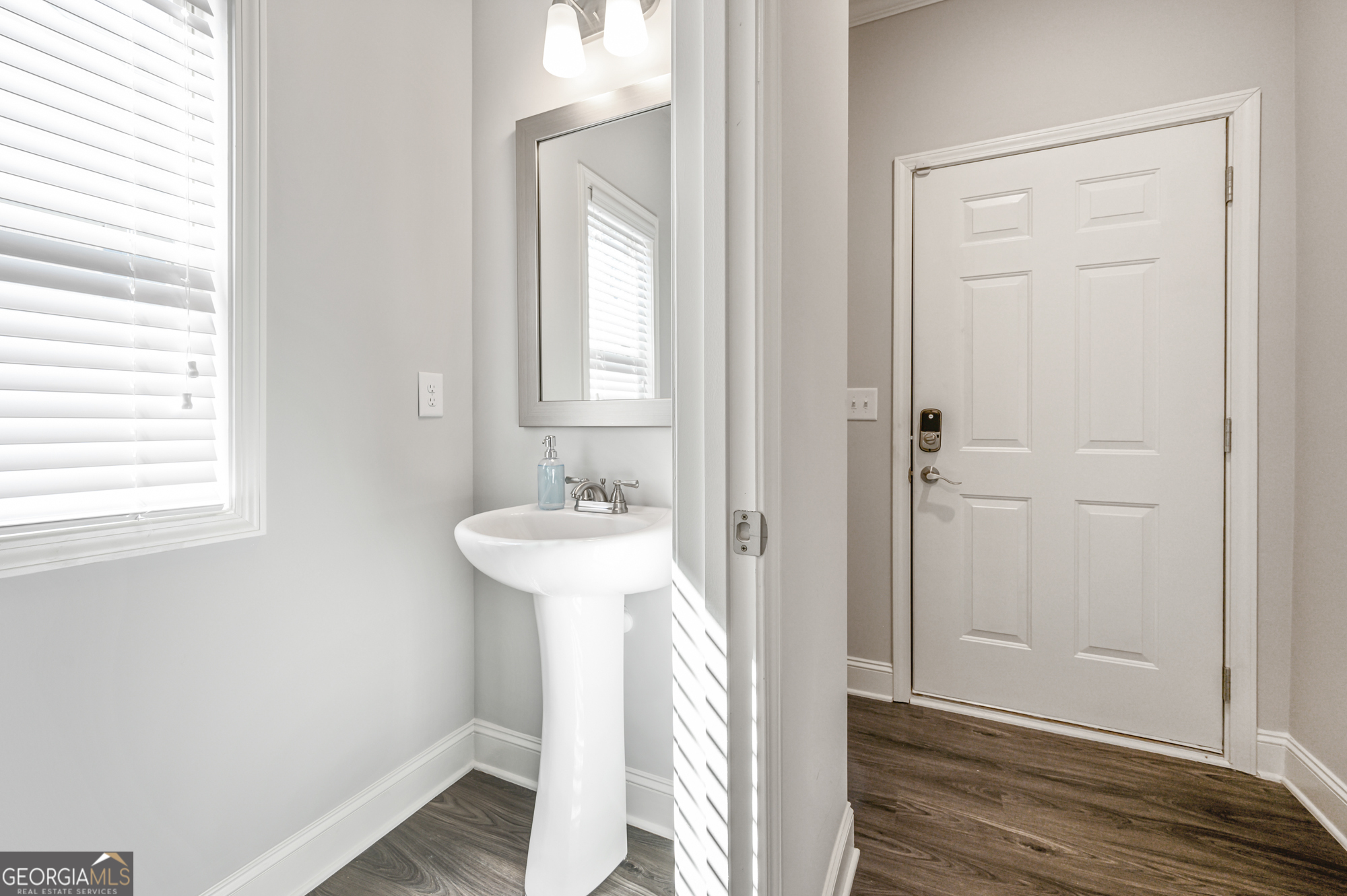 2059 Pinnacle Walk Norcross, GA 30071 - Photo 6 of 27 a bathroom with a sink and a mirror