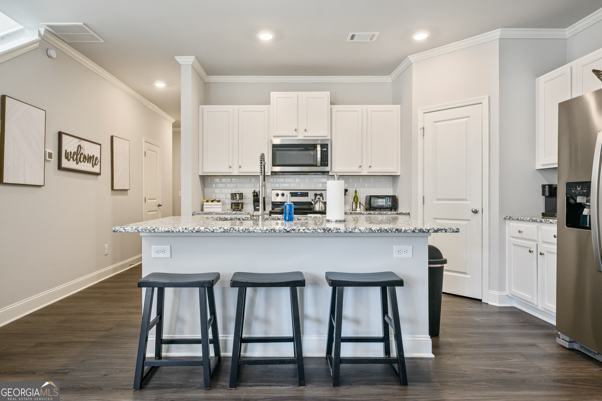 2059 Pinnacle Walk Norcross, GA 30071 - Photo 8 of 27 a kitchen with stainless steel appliances granite countertop a white cabinets and a refrigerator