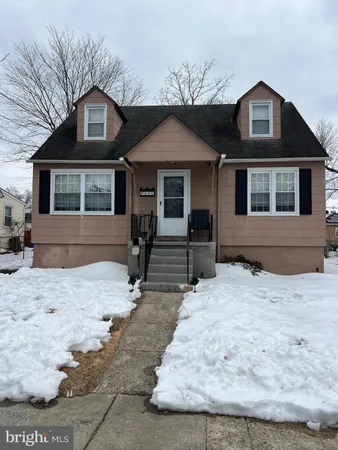 a front view of a house with yard