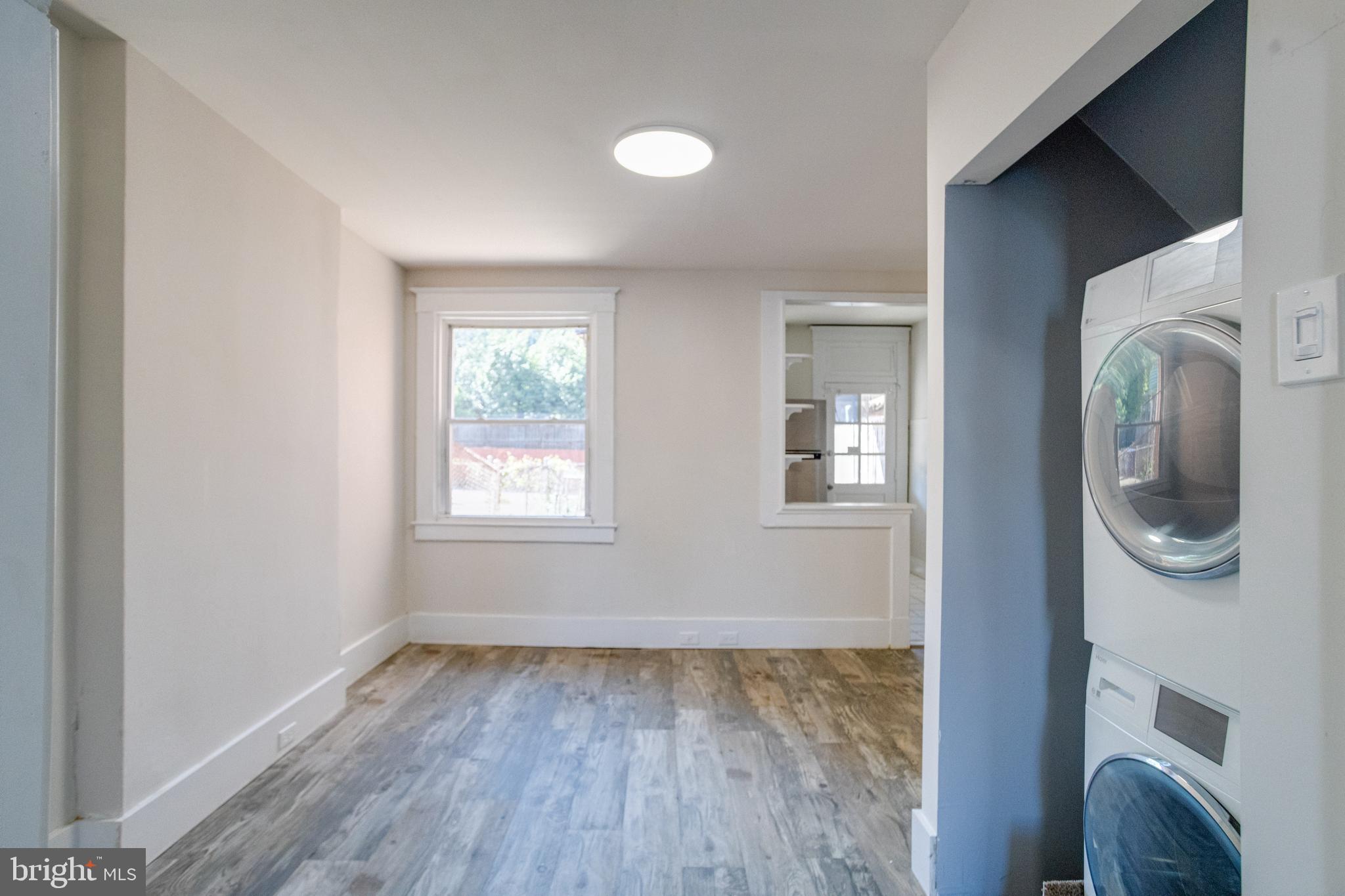 5878 Belair Road Baltimore, MD 21206 - Photo 9 of 41 wooden floor in an empty room and a window