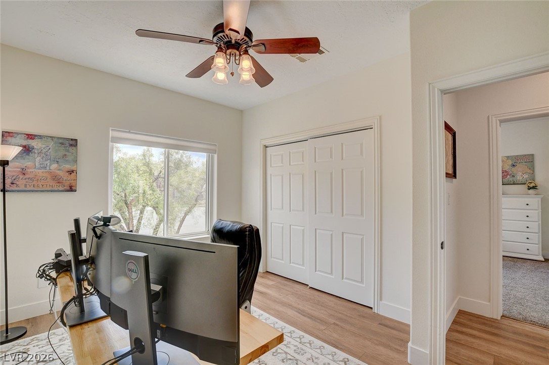 4362 Thistle Street Logandale, NV 89021 - Photo 36 of 99 A versatile space features durable LVP flooring, a large window, and an efficient ceiling fan.