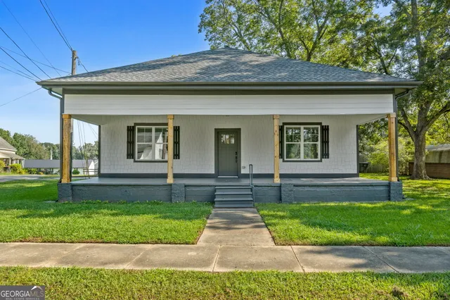 a front view of a house with a yard