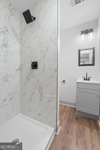 a bathroom with a bathtub and a sink