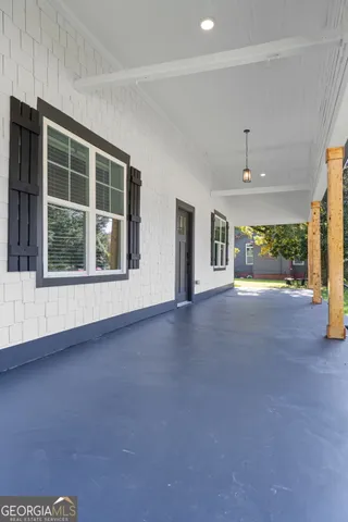 a view of a room with a large window