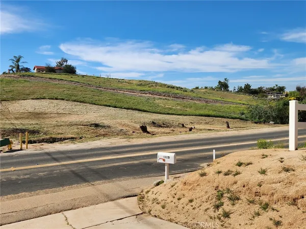 a view of a yard with an ocean view