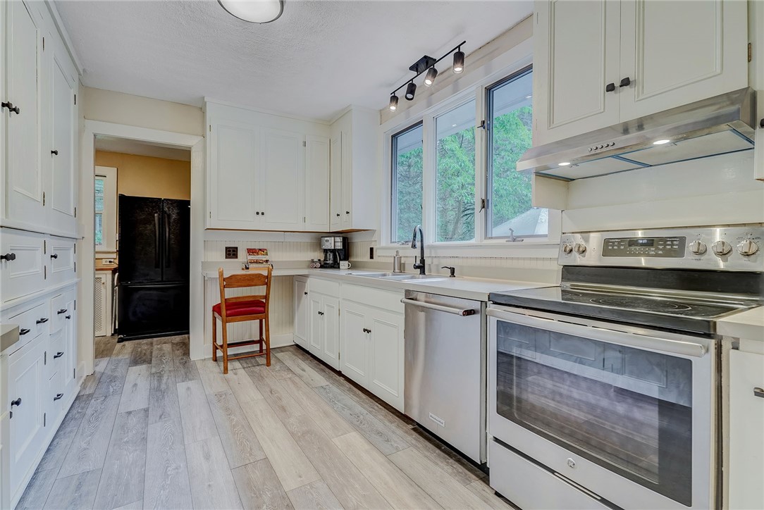 432 Penfield Road Brighton, NY 14625 - Photo 15 of 50 WHITE & BRIGHT KITCHEN WITH NEW LUXURY VINYL FLOOR