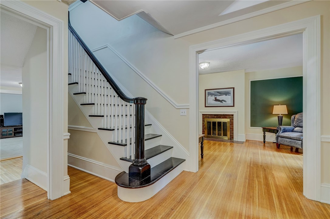 432 Penfield Road Brighton, NY 14625 - Photo 9 of 50 STUNNING STAIRCASE! GORGEOUS HARDWOODS! OPENS TO F