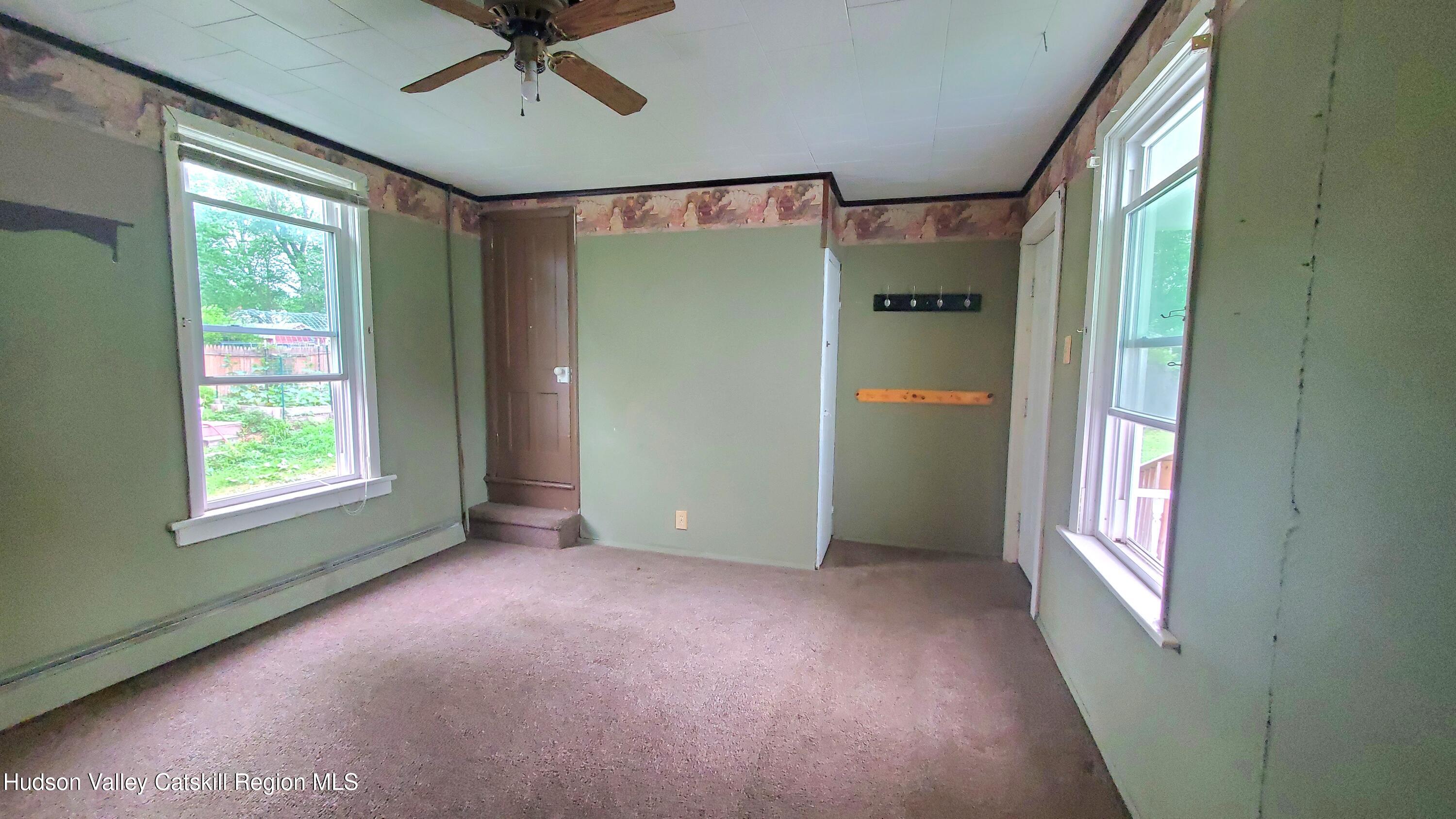 102 2nd Street Athens, NY 12015 - Photo 14 of 19 an empty room with windows and closet