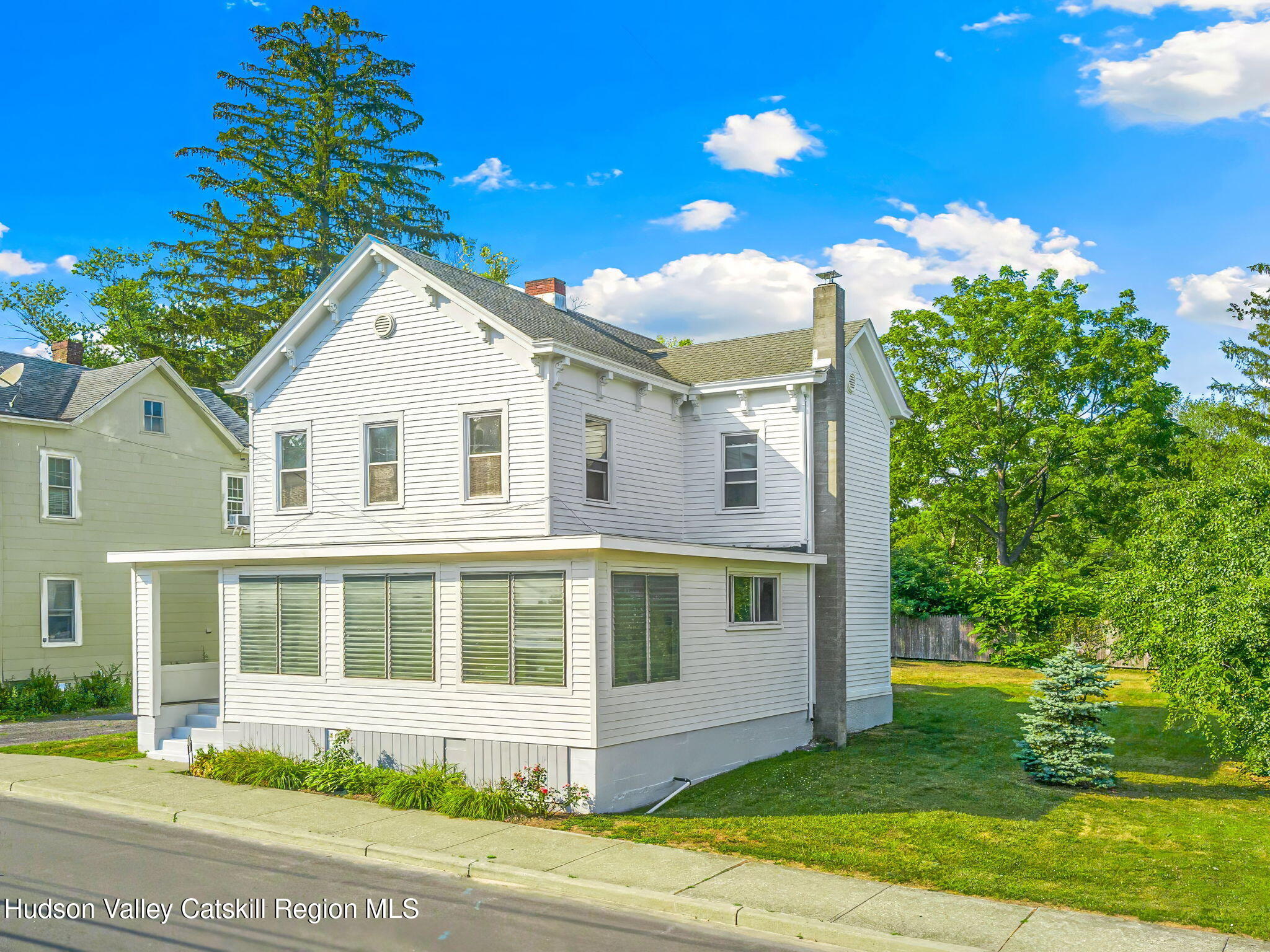 102 2nd Street Athens, NY 12015 - Photo 2 of 19 a front view of a house with a yard