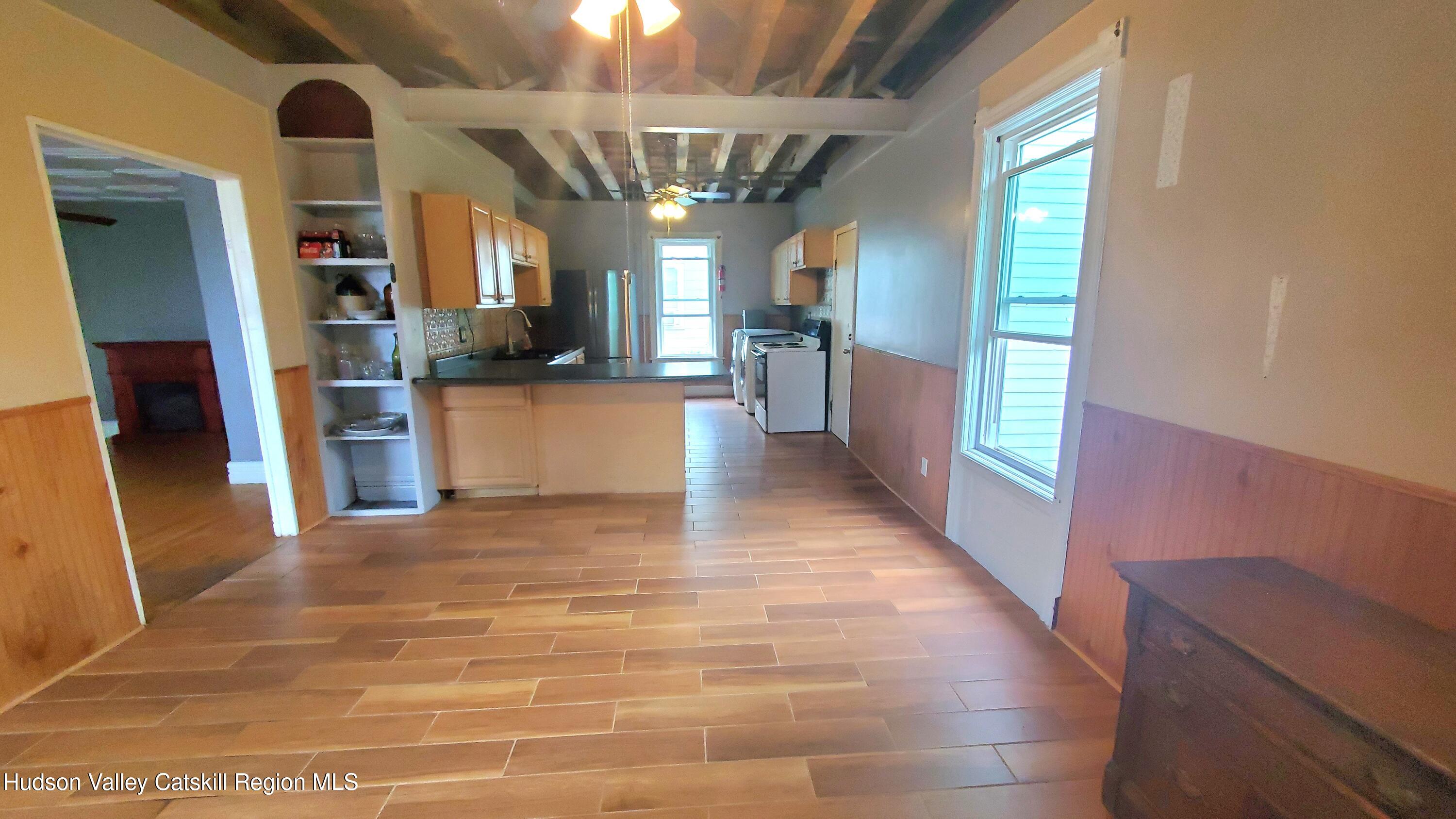 102 2nd Street Athens, NY 12015 - Photo 9 of 19 a view of a kitchen with refrigerator and a sink